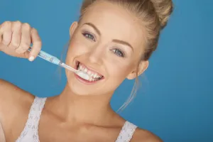 woman brushing her teeth