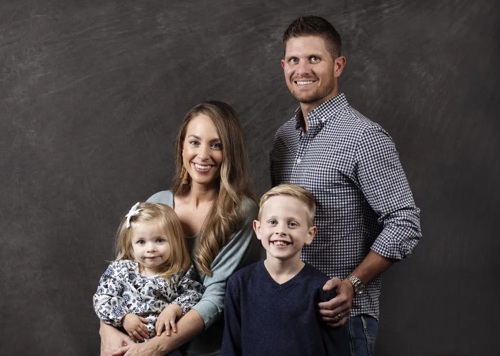 Smiling family of four