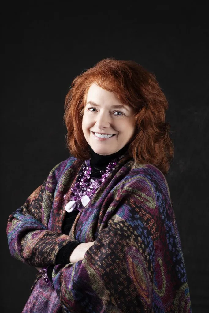 Smiling, female patient wearing patterned clothing